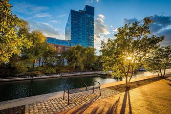 a park with a river and a tall building at 1305 Dock Street, Maryland